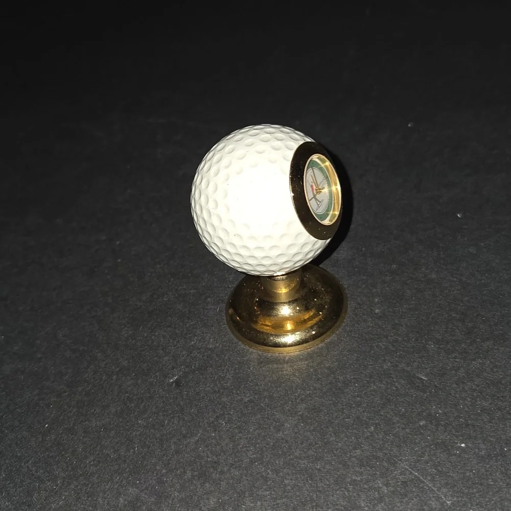 c BEAUTIFUL VINTAGE RUMOURS GOLF BALL QUARTZ CLOCK 2 1/2 TALL BRASS BASE